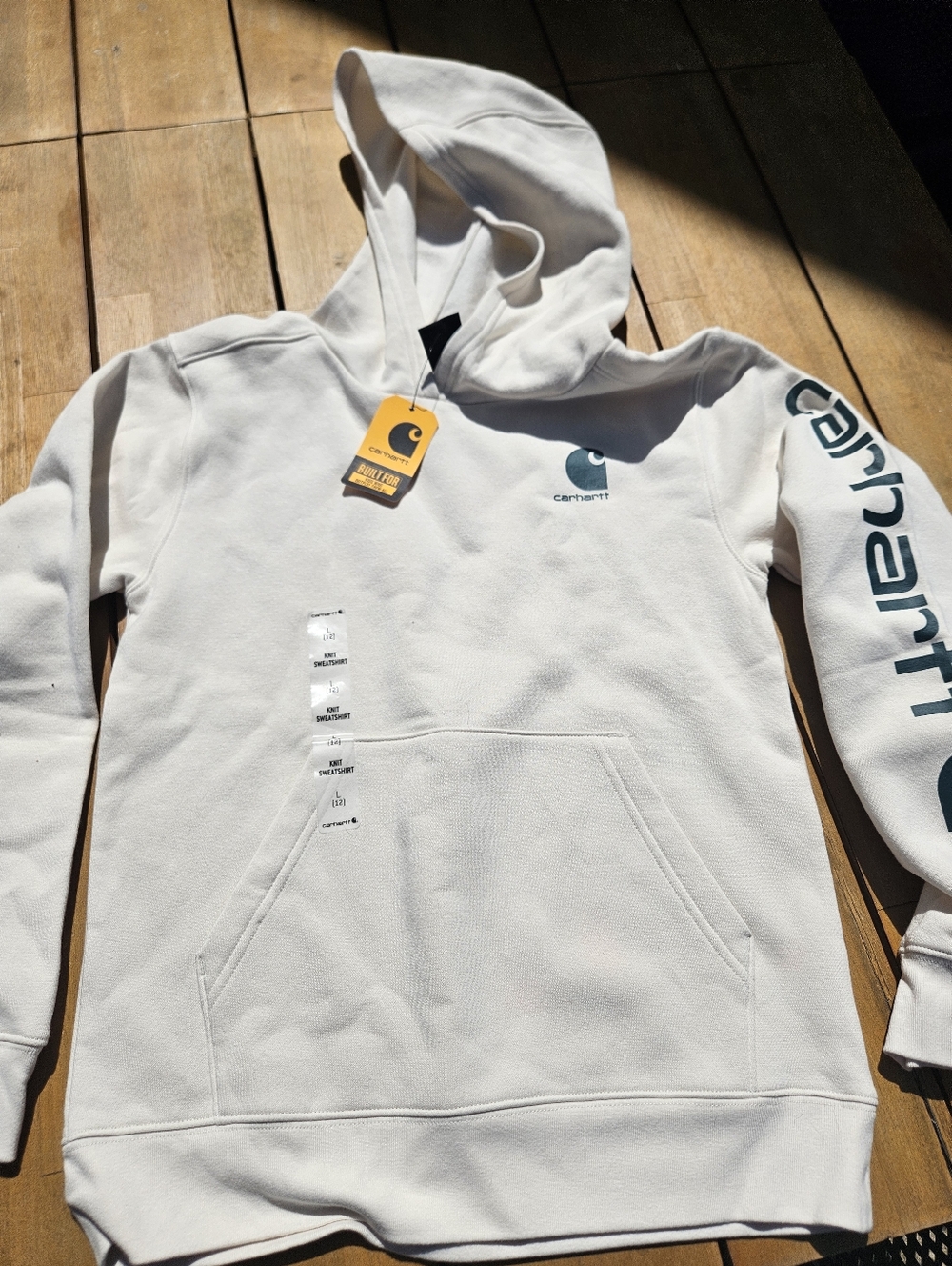 Carhartt Cream Hoodie with Teal Logo and Yellow Tag